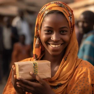 AliExpress Niger: A young and happy Nigerien woman stands in the center of Niamey and holds a gift box in her hands.